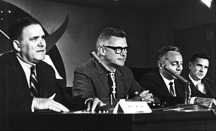 The lunar orbit rendezvous decision is announced at a NASA press conference in July 1962. Joe Shea is at the far right.