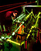 A technician evaluates the interaction of multiple lasers for use aboard the Airborne Laser. Lasertests.jpg