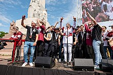 Bronze medal celebration at the foot of the Freedom Monument in Riga Latvijas hokeja izlases sveiksana (52933932402).jpg