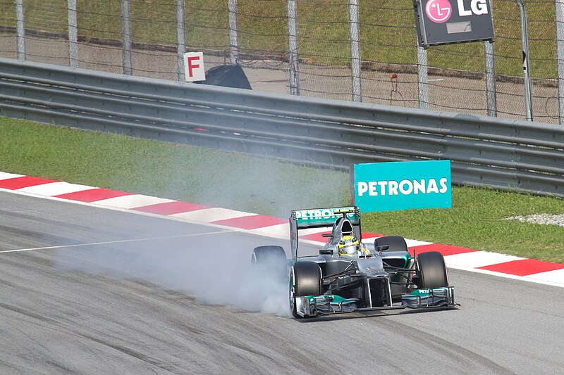 File:Nico Rosberg brake smoking 2012 Malaysia.jpg