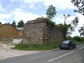 The remains of the bridge abutments which carried the Minsterley line from Cruckmeole Junction on the Cambrian Line Old railway bridge abutment - geograph.org.uk - 487437.jpg