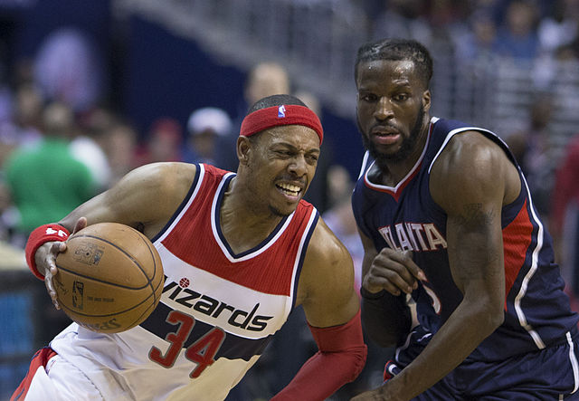 Carroll (right) with the Hawks in May 2015, defending Paul Pierce of the Washington Wizards