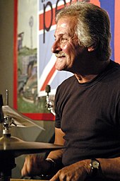 Ex-Beatles drummer Pete Best in 2006. Best was fired from the Beatles a year before "Beatlemania" started. Pete Best drumming.jpg