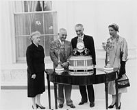 Photograph of President Truman at the White House receiving a musical clock and two candelabra, a gift for the... - NARA - 200364.jpg