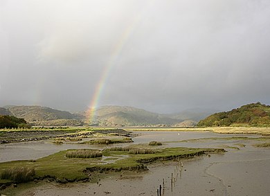 Temperature and salinity variations produced by ocean tides and freshwater rivers in estuaries make them ideal habitats for studying how temperature and salinity affect the growth of shells. Image shows the estuary of the River Mawddach in North Wales. Rainbow over the Mawddach estuary - geograph.org.uk - 601120.jpg