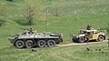 A Romanian TAB-77 (licensed built BTR-70) and a Humvee during the Infantry Day Military Demonstration.