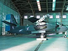 Argentine S-2T Turbo Tracker in hangar with wings folded.
