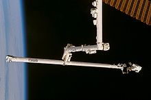 Boom in use on STS-120 STS-120 OBSS repair.jpg