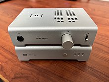A Schiit Modi+ and Magni Heretic in Silver are stacked atop one another to form what is typically called a Schiit stack. Schiit Stack (Magni Heretic and Modi+).jpg