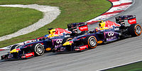 Sebastian Vettel overtaking Mark Webber 2013 Malaysia 2.jpg