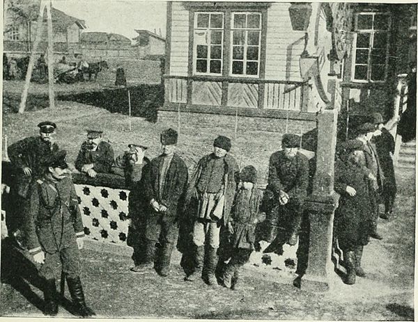 Siberian peasants watching a train at a station, 1902