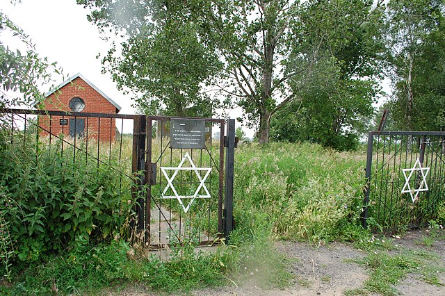 Jewish cemetery in Sochaczew, with the restored, red-brick ohel in background.