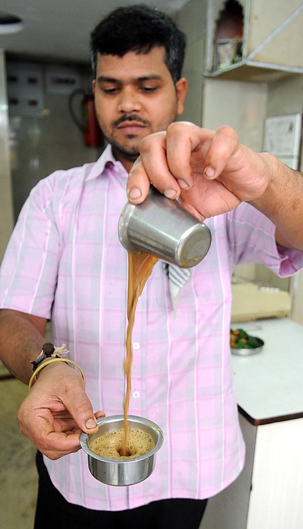Indian filter coffee being prepared for serving