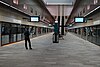 Picture of Norwest station. It consists of an underground platform with platform screen doors.