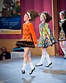 Image 19Irish dancers in Irish dancing costumes, which often feature lace or an embroidered pattern copied from the medieval Irish Book of Kells. (from Culture of Ireland)