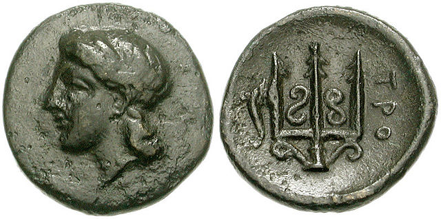 Coin (chalkous) from Troezen, 325–300 BC. Obverse: Head of Athena wearing tainia. Reverse: Ornate trident head; to left, dolphin upward, ΤΡΟ(ΙΖΗΝΙΩΝ) 