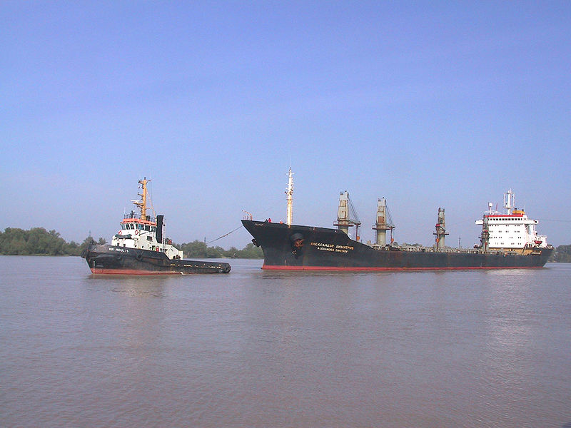 File:Tug with bulk carrier.jpg