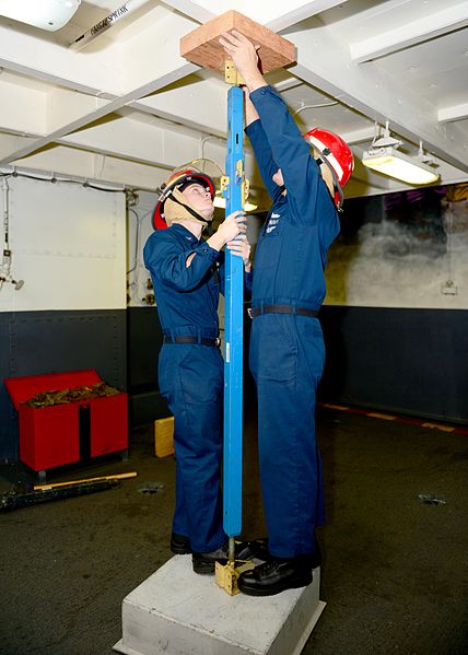 File:U.S. Navy Personnel Specialist 2nd Class Gary Smetana, right, and Personnel Specialist 3rd Class Christopher Cousins apply shoring during damage control training aboard the aircraft carrier USS Ronald Reagan 131211-N-TO979-018.jpg