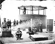 1862 picture of USS Monitor crew; the African American crewman in the right foreground is Siah Carter USSMonitor1862.4.ws.jpg