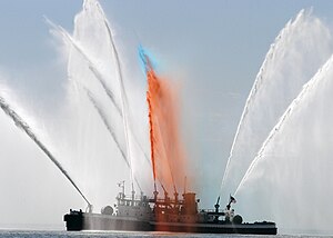 US Navy 060524-N-9640H-004 A New York City fireboat renders honors to U.S. Navy ships arriving for Fleet Week New York 2006,.jpg