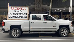 A ute parked on Queen Street, Auckland accusing Prime Minister Ardern of promoting Communism. UTE with sign displaying JACINDA Kiwi's DO NOT WANT COMMUNISM.jpg