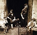 "Children of Naples". Children play while mother works. August 1944.jpg