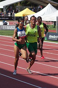 2013 Championnats du monde d'athlétisme de l'IPC - 26072013 - Jerusa Santos et Luiz Henrique Silva du Brésil au cours de la Women's 200m - T11 troisième demi-finale.jpg