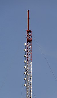 The WFIU-WTIU tower in Bloomington. The red panels at the top broadcast WTIU; the white radome-covered antennas below broadcast WFIU. 2021 08 09 wtiu-wfiu-tower 02z.jpg