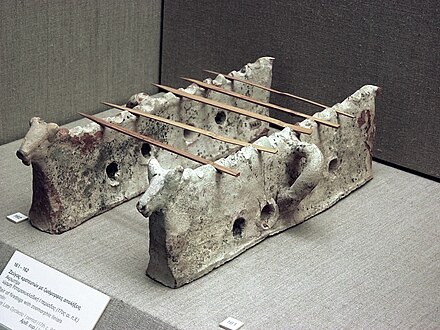 Pair of firedogs with slots for holding skewers, 17th century BC, Akrotiri.