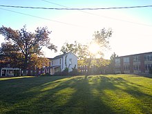 The Old Asbury Building (in white) was the first building, serving as the single schoolhouse for education. It is now used for prayer and meditation. Asbury University First Building.JPG