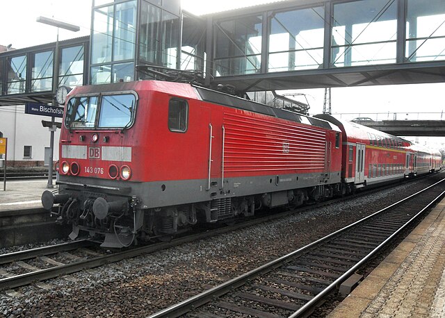 Regionalbahn train hauled by class 143 electric locomotive in Mainz-Bischofsheim station on its way to Darmstadt