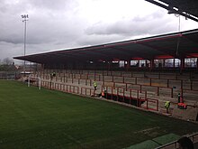 The steel and concrete from the Dane Bank Stand was recovered and used to build the St. Mary's Road End at Broadhurst Park. Broadhurst Park - SMRE under construction3.JPG