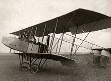 A 1912 Farman HF.20 biplane with single acting ailerons hinged from the rear spar. The ailerons hang down when at rest and are pushed up into position when flying by the force of the air, being pulled down by cable to provide control.