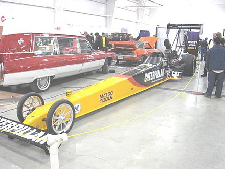 Caterpillar-sponsored dragster. Note wide slicks and high-mounted wing, to assist traction.