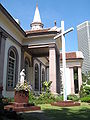 Statue of the Virgin Mary and Glorious Cross on the grounds of the Cathedral.