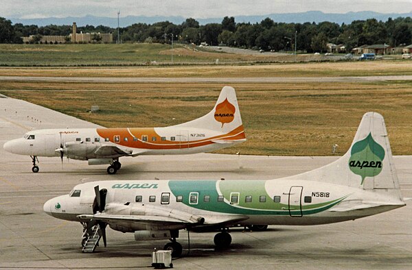 Two Convair 580s of Aspen Airways wearing variations on the company color scheme at Denver Stapleton in 1986