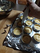 Filling tartlets with frangipane