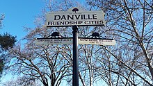 A sign nearby the Danville Library indicating its "friendship cities": Danville, Kentucky and New Ross, Ireland. Danville Friendship Cities.jpg