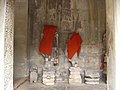 Decapitated statues at Angkor Cambodia from Flickr 376349788.jpg