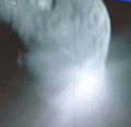 The above image from NASA TV is a view from Deep Impact's flyby showing the impactor colliding with comet Tempel 1