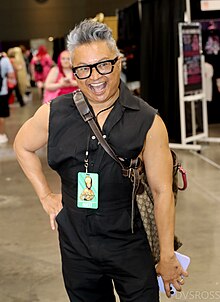 Alec Mapa (pictured at RuPaul's DragCon LA in 2023) is a guest judge. DragCon 2023 @ DVSROSS Photgraphy -174.jpg