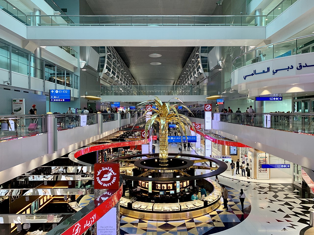 Inside Dubai International Airport Emirates Terminal 3 with its famous gold palm tree kiosk selling gold jewellery close to Dubai duty free