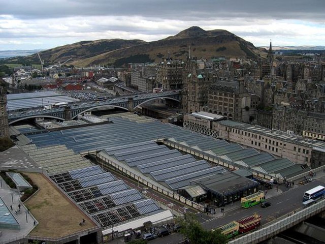 View from the Scott Monument of the Waverley Station roof, in Edinburgh, with Arthur's Seat in the background