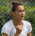 Ekaterina Bychkova competing in the second round of the 2015 Wimbledon Qualifying Tournament at the Bank of England Sports Grounds in Roehampton, England. The winners of three rounds of competition qualify for the main draw of Wimbledon the following week.