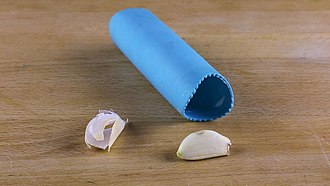 Silicon tube garlic peeler with peeled garlic clove Garlic peeler-12.jpg
