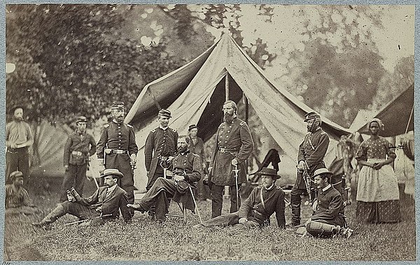 Porter (seated in chair) and staff