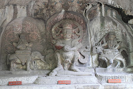 Dàhēitiān (center) flanked by the bodhisattvas Samantabhadra (left) and Mañjuśrī (right). Baocheng Temple, Hangzhou, Zhejiang, China