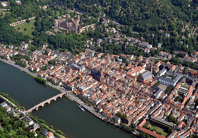 Heidelberg with the Neckar river and the vast Heidelberg Schloss (upper picture part)