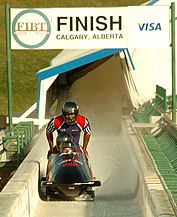 An American bobsleigh team, driven by Steve Holcomb (front), finishing first in the final day of US National Bobsled trials held in Calgary on November 2, 2005.