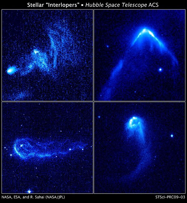 Four runaway stars moving through regions of dense interstellar gas and creating bright bow waves and trailing tails of glowing gas. The stars in thes